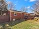A brick home features a wooden deck perfect for outdoor enjoyment in the backyard at 3204 Starrland Dr, Gastonia, NC 28052
