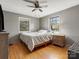 Bedroom with hardwood floors, two windows, and neutral-colored walls at 3204 Starrland Dr, Gastonia, NC 28052