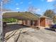 Exterior view of a home featuring a long carport with a brick base and a car at 3204 Starrland Dr, Gastonia, NC 28052