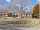Lovely brick ranch-style home with mature trees, fenced yard, and convenient carport at 3204 Starrland Dr, Gastonia, NC 28052