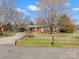 Charming brick ranch-style home featuring a fenced yard, carport, and beautiful curb appeal at 3204 Starrland Dr, Gastonia, NC 28052