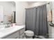 Clean bathroom featuring a sink vanity and a shower with a gray patterned curtain at 3308 Timber Mill Dr, Stallings, NC 28104