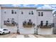 Modern townhomes with gray siding, balconies, and attached garages at 3308 Timber Mill Dr, Stallings, NC 28104