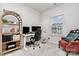 Well-lit home office with modern furnishings and a comfortable accent chair at 3308 Timber Mill Dr, Stallings, NC 28104