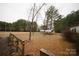 Backyard featuring a storage structure and view of the surrounding trees at 351 York Spann Rd, Hamptonville, NC 27020