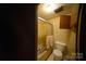 A compact bathroom with a shower and toilet at 351 York Spann Rd, Hamptonville, NC 27020