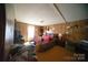 View of the bedroom with wood-paneled walls, packed with furniture and personal items at 351 York Spann Rd, Hamptonville, NC 27020