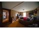 View of bedroom, featuring wood paneling and a bed, with natural light at 351 York Spann Rd, Hamptonville, NC 27020