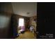 Modest bedroom with wood-paneled walls and a window providing natural light at 351 York Spann Rd, Hamptonville, NC 27020