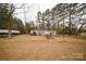 Cozy single story home with a front yard, carport, and inviting outdoor space at 351 York Spann Rd, Hamptonville, NC 27020