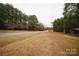 Expansive grassy yard with a tree line, offering ample space for outdoor activities and enjoyment at 351 York Spann Rd, Hamptonville, NC 27020