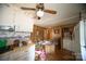 Kitchen and laundry area with white cabinets and vintage appliances, offering essential amenities with a practical layout at 351 York Spann Rd, Hamptonville, NC 27020
