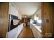 Functional kitchen with white cabinets and ample countertop space, perfect for preparing meals with a vintage aesthetic at 351 York Spann Rd, Hamptonville, NC 27020