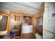 Laundry area adjacent to the kitchen with washer, dryer, and additional storage space, enhancing convenience for chores at 351 York Spann Rd, Hamptonville, NC 27020
