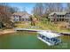 Beautifully landscaped lakeside home featuring a private dock and covered boat slip at 4164 54Th Ne Ave, Hickory, NC 28601