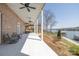 Enjoy this spacious back porch with white columns and views of the lake at 4164 54Th Ne Ave, Hickory, NC 28601