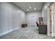 Finished basement with tile flooring, a desk area, and ample storage space at 4164 54Th Ne Ave, Hickory, NC 28601
