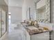 Elegant bathroom featuring a double vanity with marble countertops and modern fixtures at 4164 54Th Ne Ave, Hickory, NC 28601