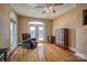 Bedroom features hardwood flooring, a water view, and a chair for relaxing at 4164 54Th Ne Ave, Hickory, NC 28601