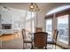 Bright dining area with high ceilings, a glass table with seating for four, and beautiful lake views at 4164 54Th Ne Ave, Hickory, NC 28601
