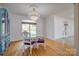 Dining area with hardwood flooring, chandelier, and view to the lake through the window at 4164 54Th Ne Ave, Hickory, NC 28601