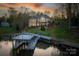 Waterfront home featuring a private dock, meticulous landscaping, and a brick exterior with a balcony overlooking the lake at 4164 54Th Ne Ave, Hickory, NC 28601
