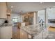 Open kitchen with custom cabinets, granite countertops, a kitchen island with seating, and stainless steel appliances at 4164 54Th Ne Ave, Hickory, NC 28601