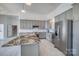 Well-lit kitchen featuring stainless steel appliances, gray cabinets, and center island at 4164 54Th Ne Ave, Hickory, NC 28601