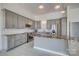 Stylish kitchen boasts stainless steel appliances, gray cabinets, and a large island at 4164 54Th Ne Ave, Hickory, NC 28601