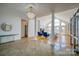 Open concept living area with tile and hardwood floors, large windows, and views of the lake at 4164 54Th Ne Ave, Hickory, NC 28601