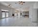 Spacious living room with a fireplace, tile flooring, and open access to the kitchen at 4164 54Th Ne Ave, Hickory, NC 28601