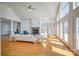 Spacious living room with hardwood floors, a fireplace, large windows, and French doors that offer access to the outside at 4164 54Th Ne Ave, Hickory, NC 28601