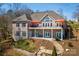 Brick home featuring two levels of covered back porches, stone stairs, and beautifully landscaped yard at 4164 54Th Ne Ave, Hickory, NC 28601