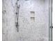Shower with hexagon tiles, handheld shower fixture, and built-in storage at 4164 54Th Ne Ave, Hickory, NC 28601