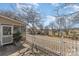 A charming backyard features a white picket fence, lush landscaping, and a cozy patio area at 706 Skinner Rd, Shelby, NC 28152