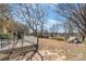 A spacious backyard with a white picket fence and a screened-in porch, perfect for outdoor enjoyment at 706 Skinner Rd, Shelby, NC 28152