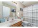 Bright bathroom featuring a vanity with sink, a toilet, and a shower with curtain at 706 Skinner Rd, Shelby, NC 28152