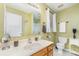Well-lit bathroom features a vanity with sink, a toilet, and a shower with a glass door at 706 Skinner Rd, Shelby, NC 28152