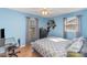 Bright bedroom with natural light has modern decor, a fan, and wood-look flooring at 706 Skinner Rd, Shelby, NC 28152