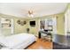 Comfortable bedroom with hardwood floors, ample natural light, and a functional workspace at 706 Skinner Rd, Shelby, NC 28152