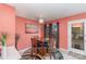 Charming dining area with wooden table, stylish lighting, and access to the outdoors at 706 Skinner Rd, Shelby, NC 28152