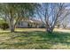 Front yard of the single story home surrounded by large mature trees at 706 Skinner Rd, Shelby, NC 28152