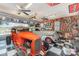 Spacious garage with classic cars, checkered floors, and walls decorated with memorabilia at 706 Skinner Rd, Shelby, NC 28152