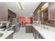 Bright kitchen with stainless steel appliances, dark wood cabinets, and a view to the dining area at 706 Skinner Rd, Shelby, NC 28152