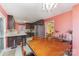 Open kitchen with a dining area featuring stainless steel appliances and dark wood cabinetry at 706 Skinner Rd, Shelby, NC 28152