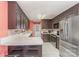 Spacious kitchen with stainless steel appliances, granite countertops, and dark wood cabinets at 706 Skinner Rd, Shelby, NC 28152