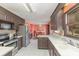 Bright kitchen with stainless steel appliances, dark wood cabinets, and an eat in dining area at 706 Skinner Rd, Shelby, NC 28152