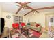 Cozy living room featuring wood beams, ceiling fans, and colorful decor creating a warm atmosphere at 706 Skinner Rd, Shelby, NC 28152