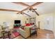Spacious living room featuring beamed ceilings and hardwood flooring at 706 Skinner Rd, Shelby, NC 28152