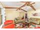 Open living room featuring beamed ceilings and hardwood flooring at 706 Skinner Rd, Shelby, NC 28152
